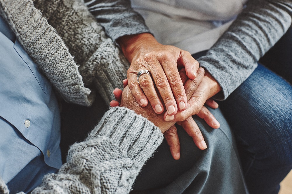 seniors holding hands