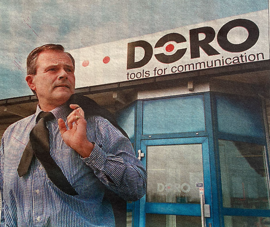 Claes Dinkelspiel outside early Doro office building with tools for communication signage