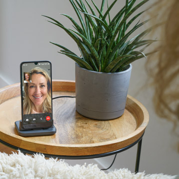 Doro smartphone on a table showing a video call