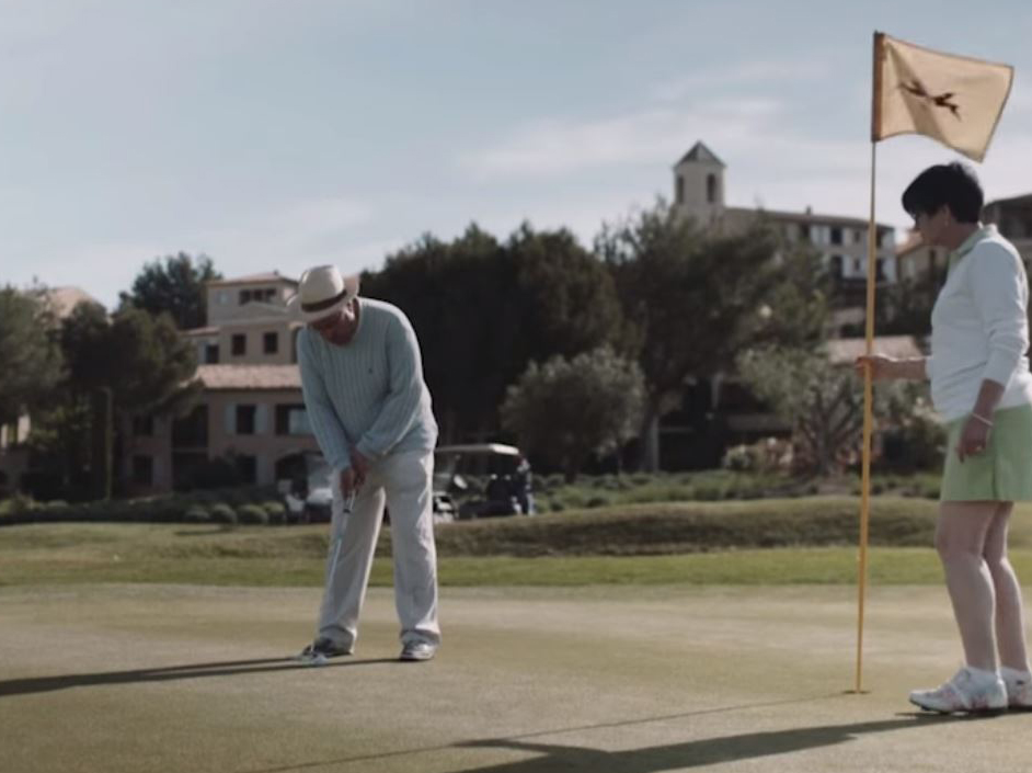 Couple on a golf green.