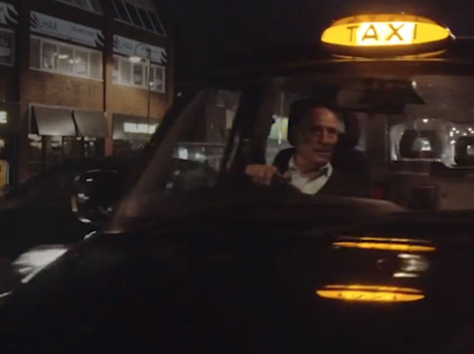 Taxi driver receiving payment.